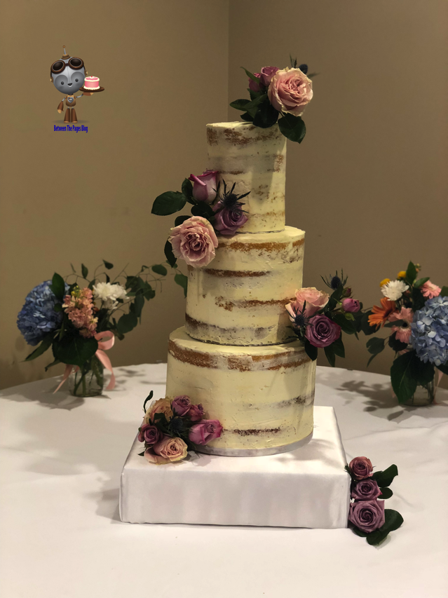 Semi Naked Wedding Cake with flower corsages