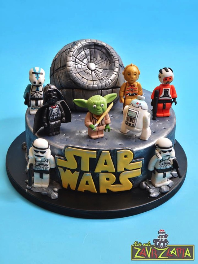 A LEGO Star Wars cake with many fondant LEGO Minifigures on top of it