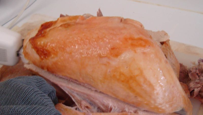 Cutting off the turkey breast