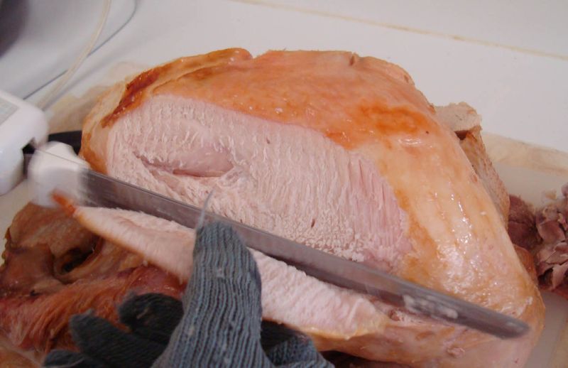 Slicing the turkey breast slices