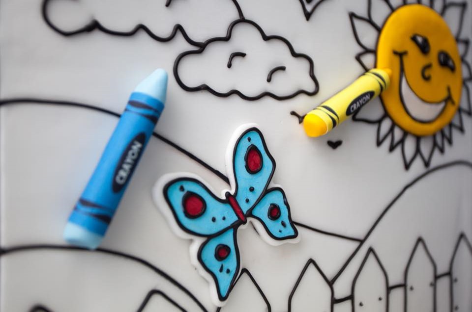 A blue butterfly with red spots