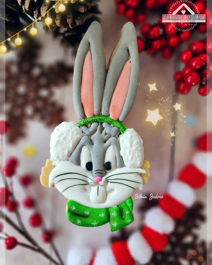 Bugs Bunny is wearing a green scarf and matching ear muffs